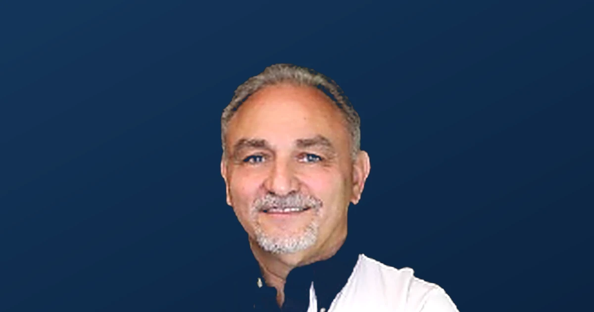 Fred Wulff, REALTOR with RE/MAX Corridor and San Antonio Homes Connection, wearing a Texas star jacket