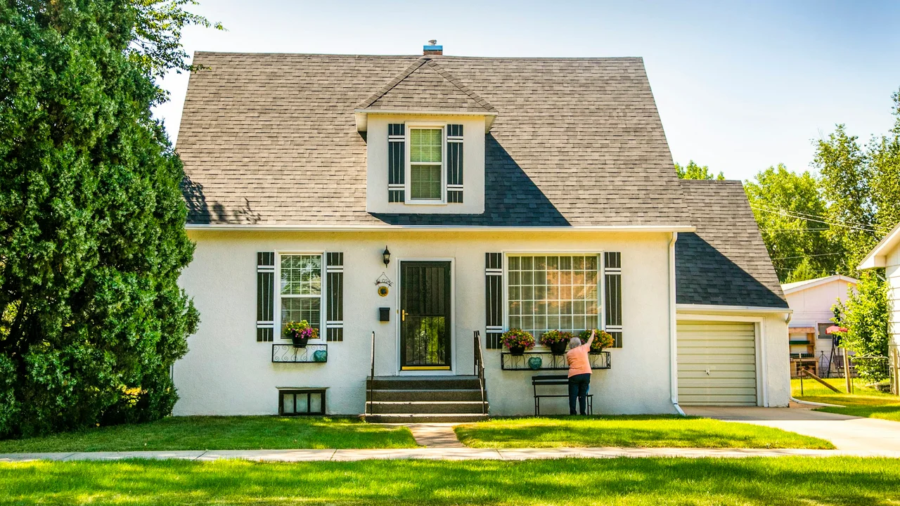 A charming London Ontario home being prepared for sale, with fresh flowers by the front porch